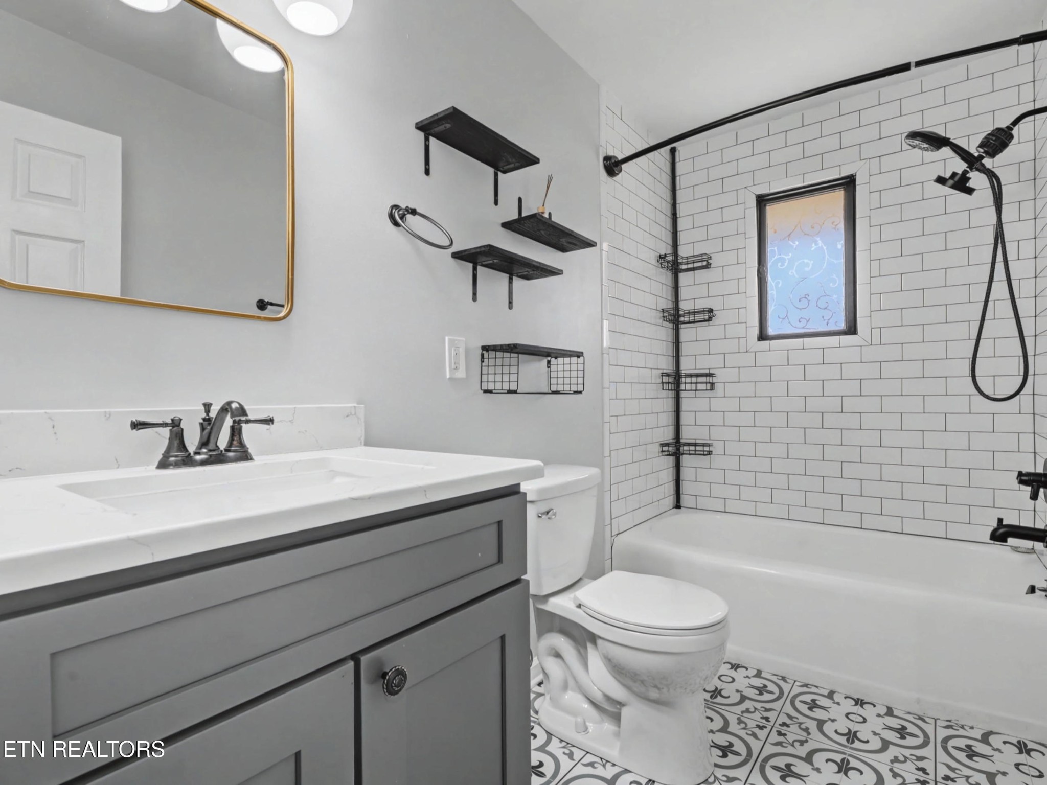 209 Wakefield Road Knoxville, TN 37922 - Photo 22 of 29 a bathroom with a sink a toilet and a bathtub