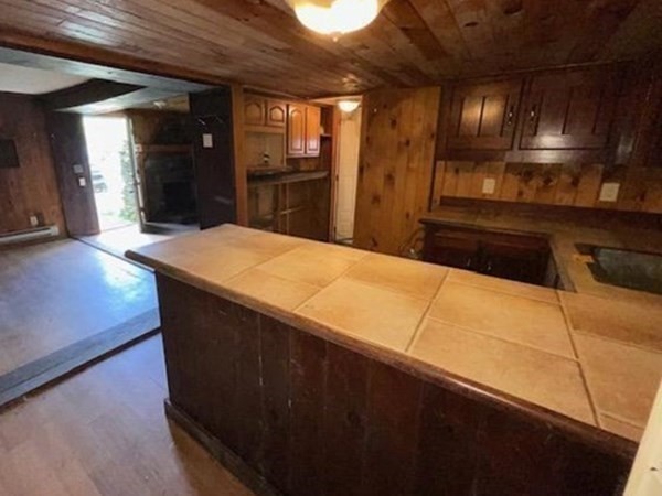 79 Station Road Barre, MA 01005 - Photo 4 of 13 a kitchen with kitchen island sink and refrigerator
