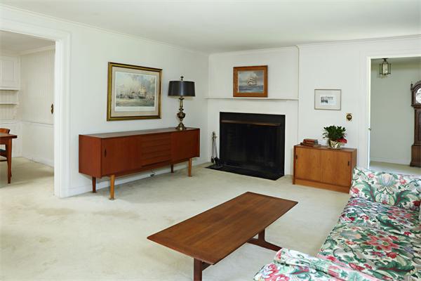 85 Standish Road Wellesley, MA 02481 - Photo 2 of 5 a living room with furniture and a fireplace