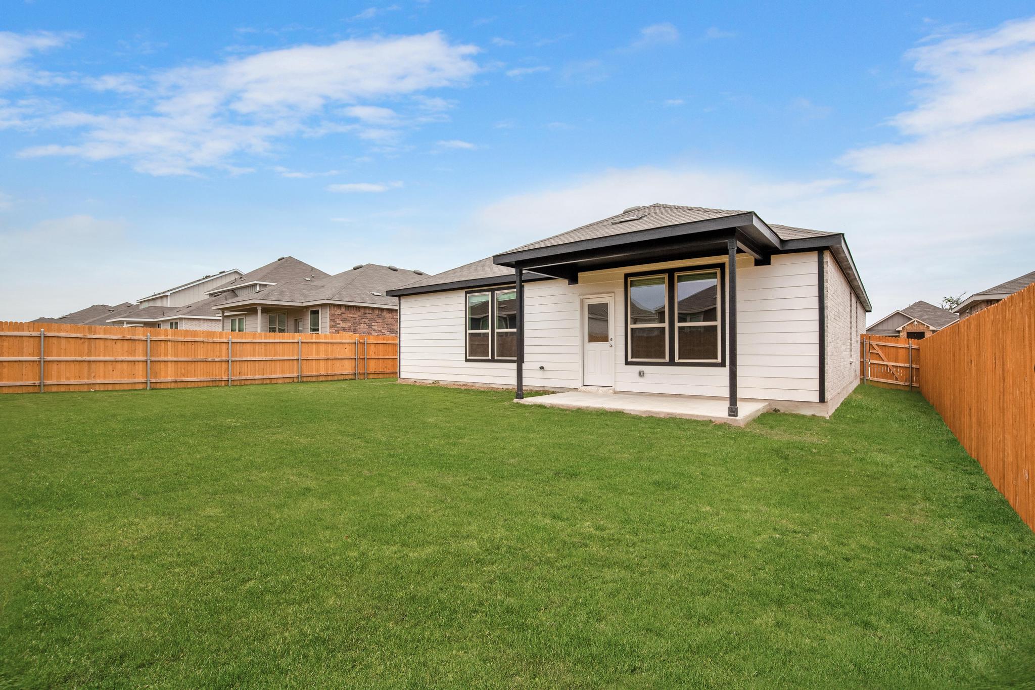 200 Janice Road Taylor, TX 76574 - Photo 25 of 25 A neatly manicured lawn provides ample space for outdoor enjoyment at this residence.