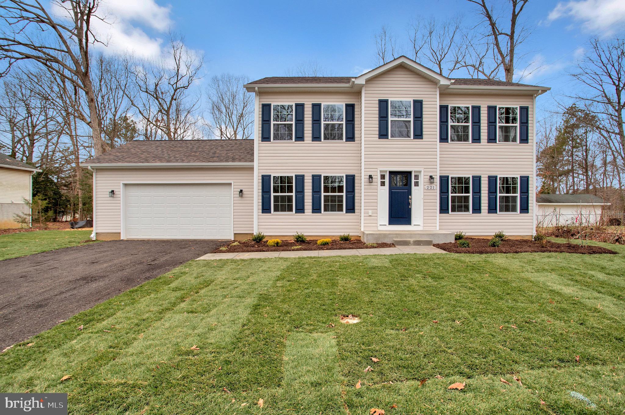 11541 Bootstrap Trail Lusby, MD 20657 - Photo 1 of 24 a front view of a house with a yard