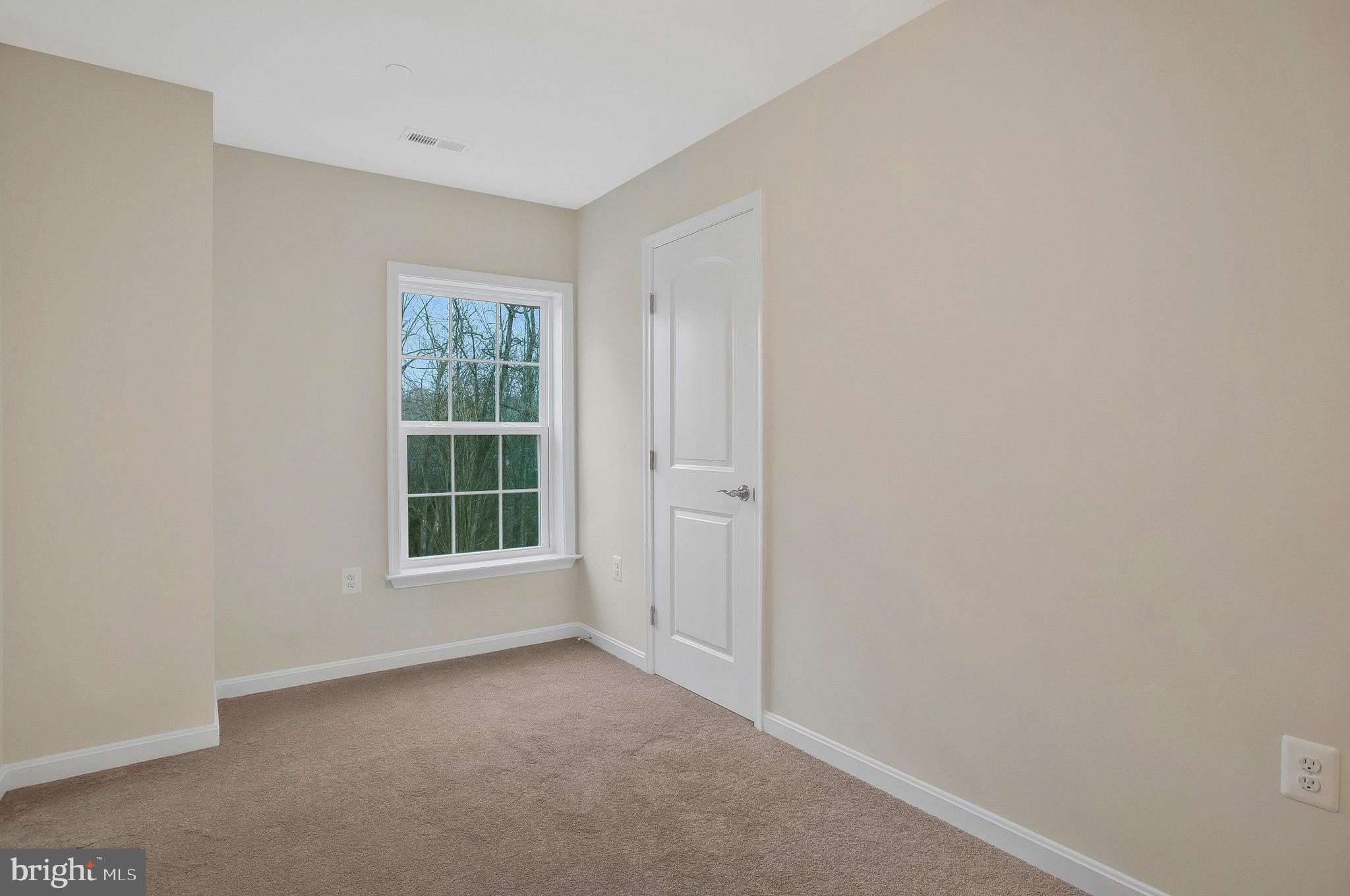 11541 Bootstrap Trail Lusby, MD 20657 - Photo 17 of 24 an empty room with a window