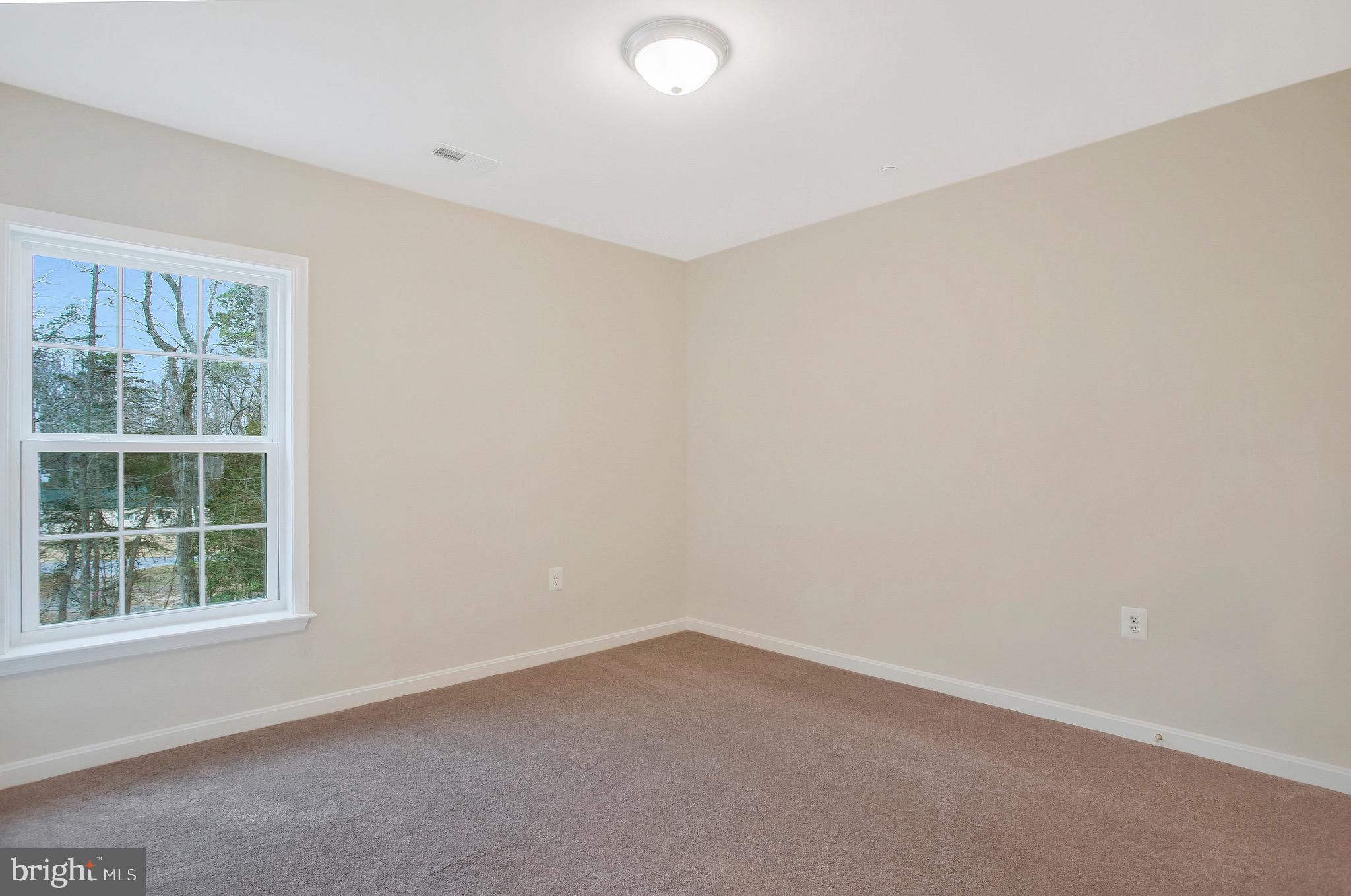 11541 Bootstrap Trail Lusby, MD 20657 - Photo 20 of 24 an empty room with a window