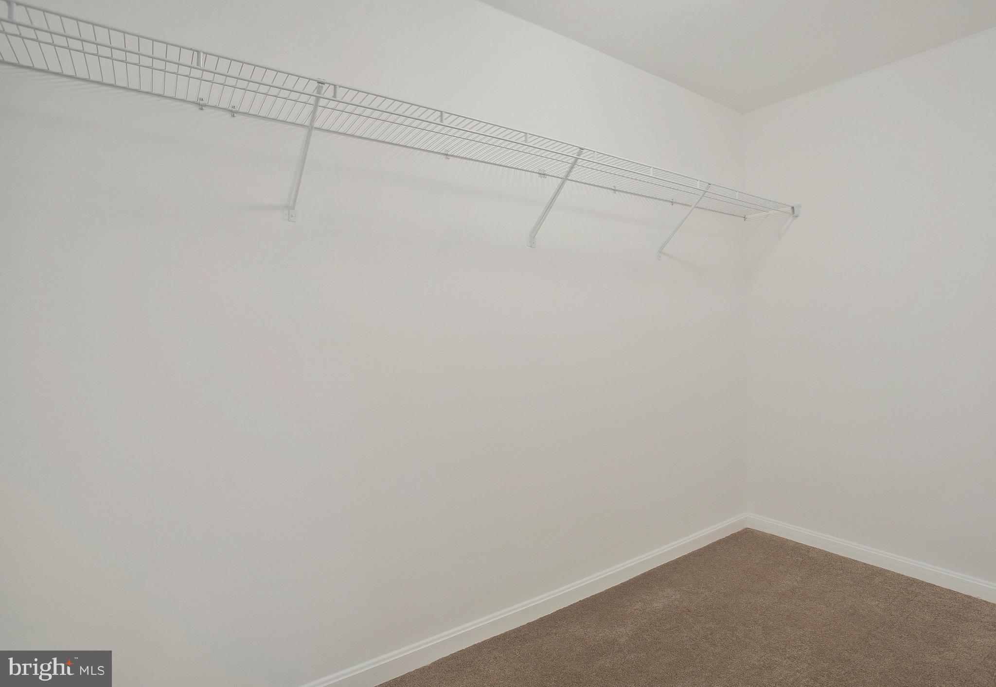 11541 Bootstrap Trail Lusby, MD 20657 - Photo 24 of 24 a view of a room with racks on the wall