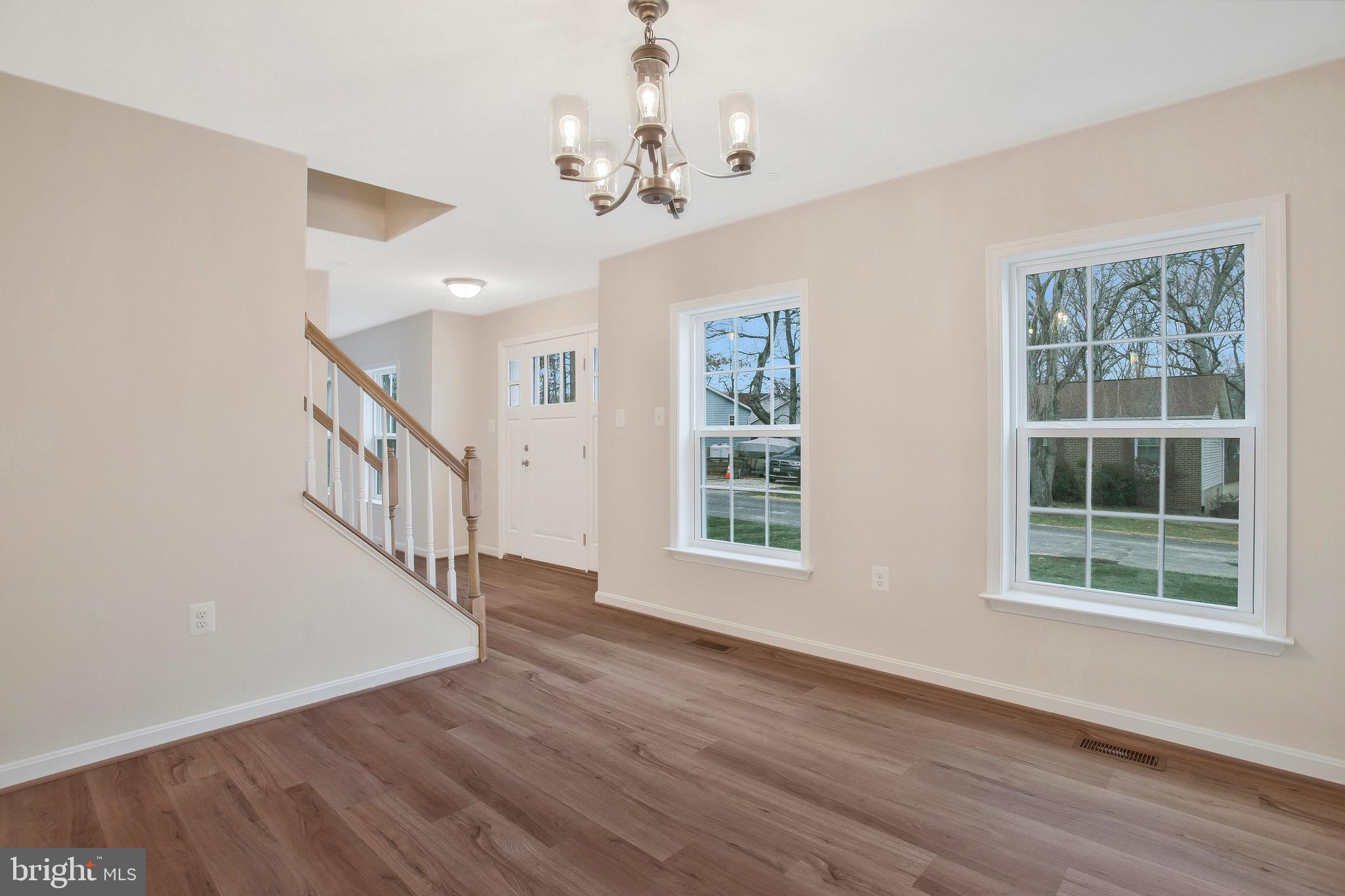 11541 Bootstrap Trail Lusby, MD 20657 - Photo 6 of 24 a view of an entryway with wooden floor and windows