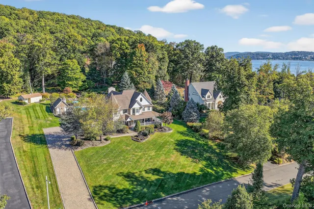 an aerial view of a house with garden space and street view