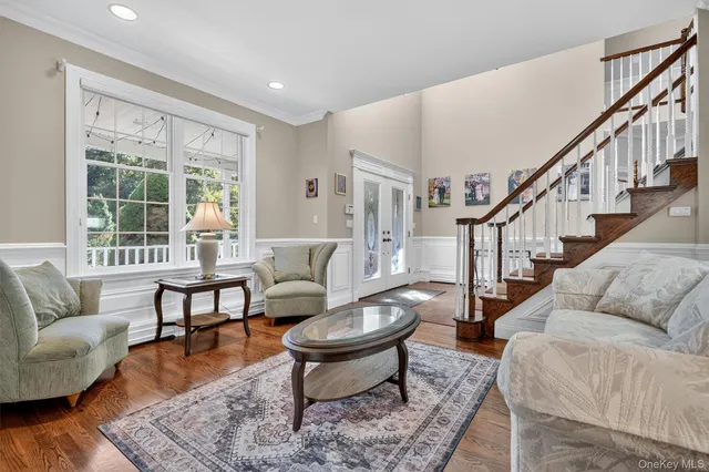 a living room with furniture and a rug