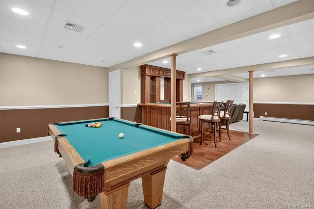 a room with furniture and gym equipment