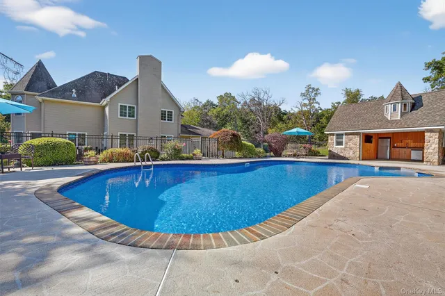 a view of a house with swimming pool