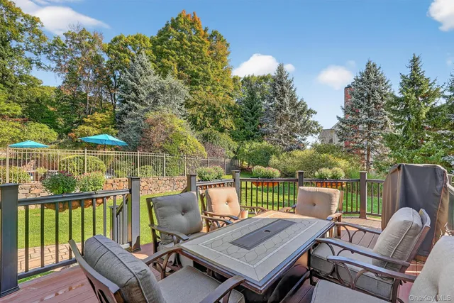 a view of a deck with wooden floor and outdoor seating