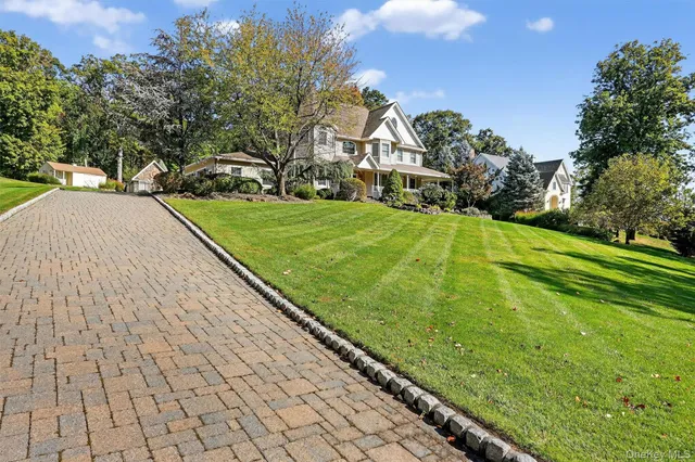a view of a yard with cars
