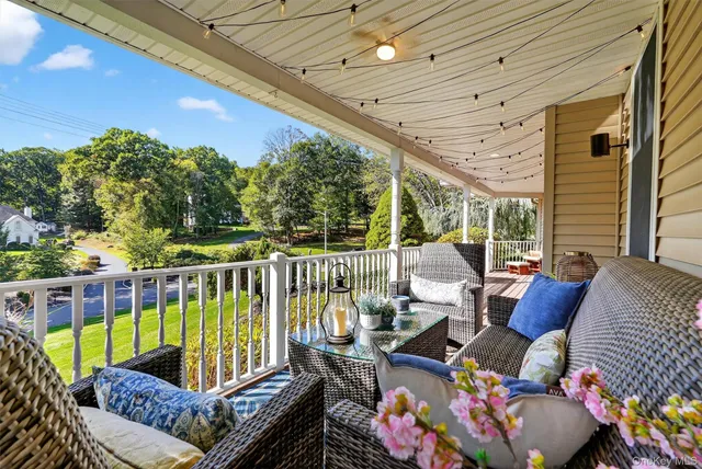 a view of balcony with furniture