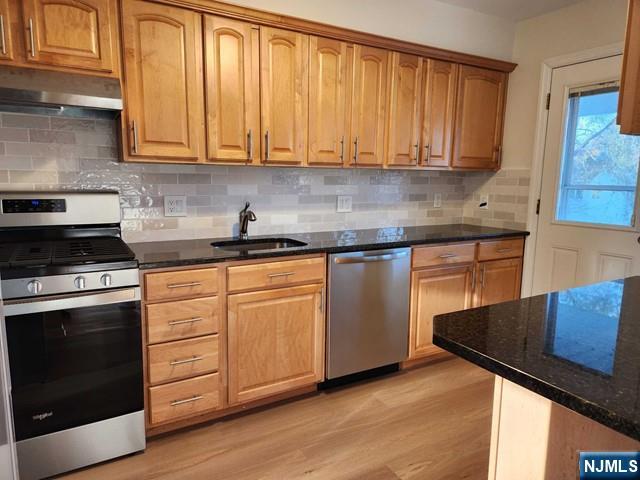 467 Spring Valley Road Paramus, NJ 07652 - Photo 4 of 20 a kitchen with granite countertop wooden cabinets and a stove top oven