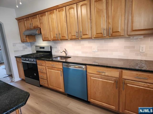 467 Spring Valley Road Paramus, NJ 07652 - Photo 6 of 20 a kitchen with granite countertop wooden cabinets stainless steel appliances and a sink
