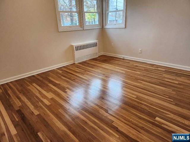 467 Spring Valley Road Paramus, NJ 07652 - Photo 9 of 20 a view of a room with wooden floor and window