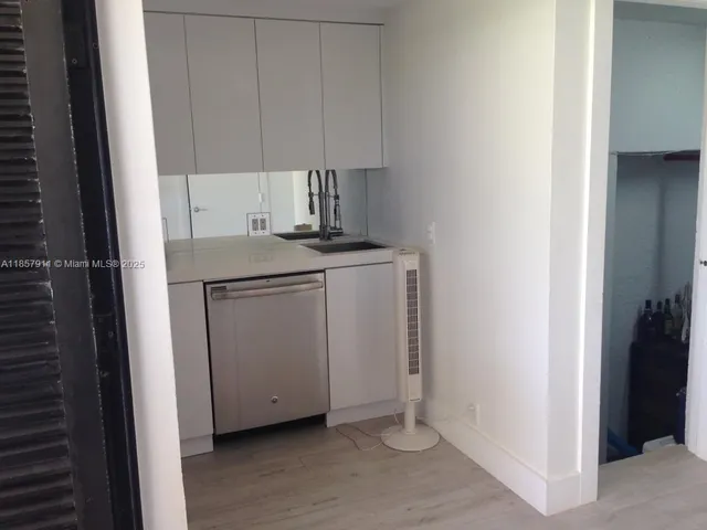 a kitchen with a stove and a refrigerator