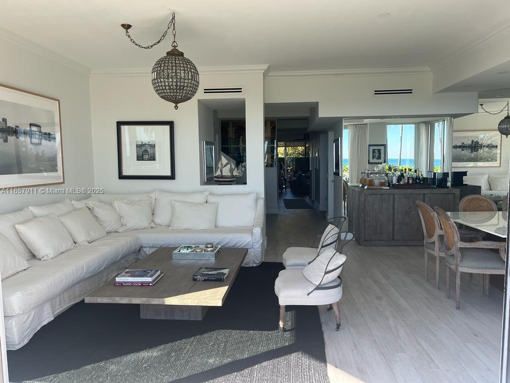 201 Crandon Boulevard, Unit 177 Key Biscayne, FL 33149 - Photo 4 of 24 a living room with furniture and a large window