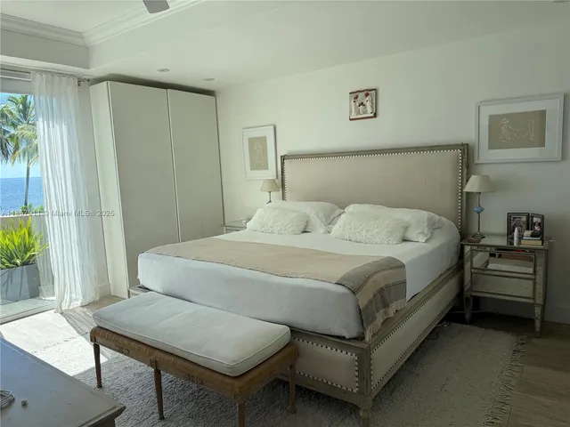 a bedroom with a bed and a table in it