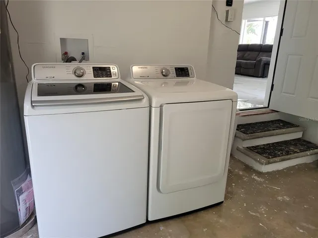 a utility room with dryer and washer