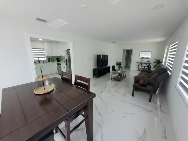 a view of a dining room with furniture
