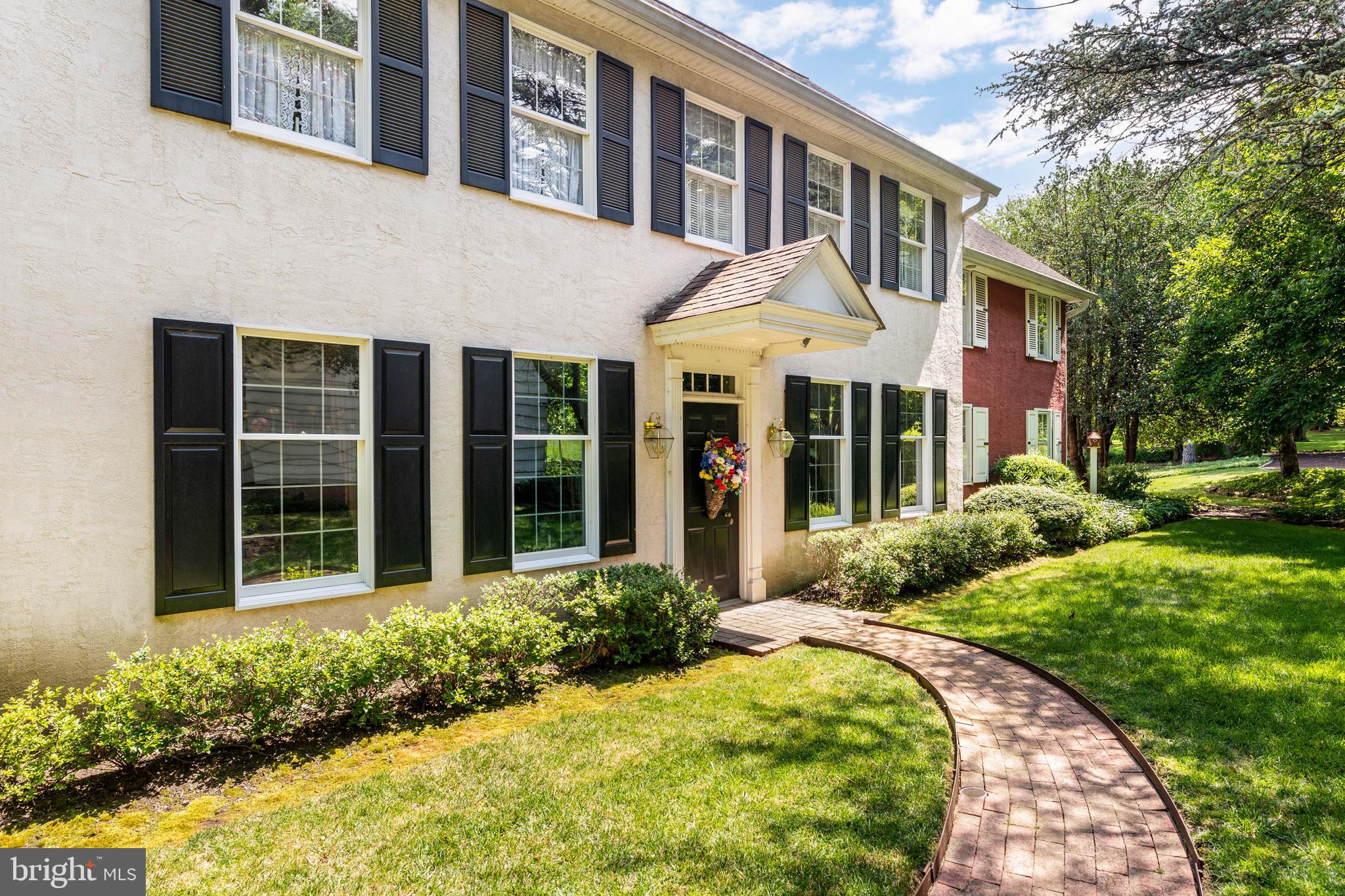 2070 Huntingdon Road Huntingdon Valley, PA 19006 - Photo 2 of 76 a front view of a house with a yard