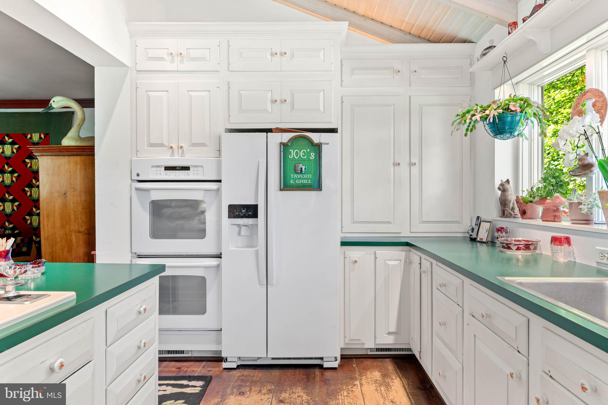 2070 Huntingdon Road Huntingdon Valley, PA 19006 - Photo 21 of 76 a kitchen with stainless steel appliances a white cabinets and a wooden floors