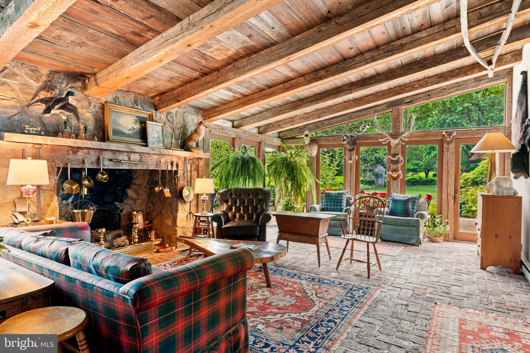 2070 Huntingdon Road Huntingdon Valley, PA 19006 - Photo 39 of 76 a living room with furniture and a fireplace