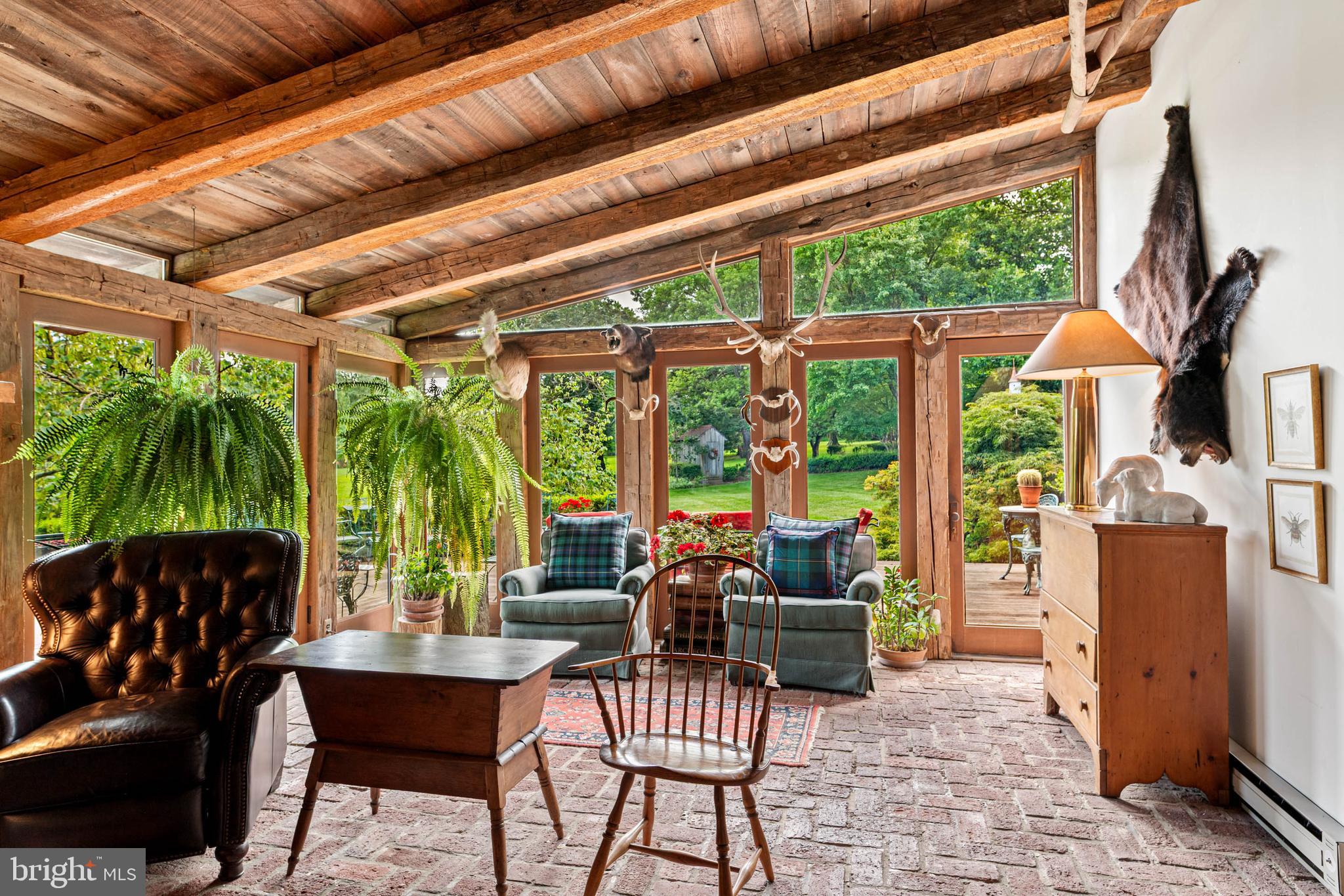2070 Huntingdon Road Huntingdon Valley, PA 19006 - Photo 40 of 76 a living room with patio furniture and a floor to ceiling window
