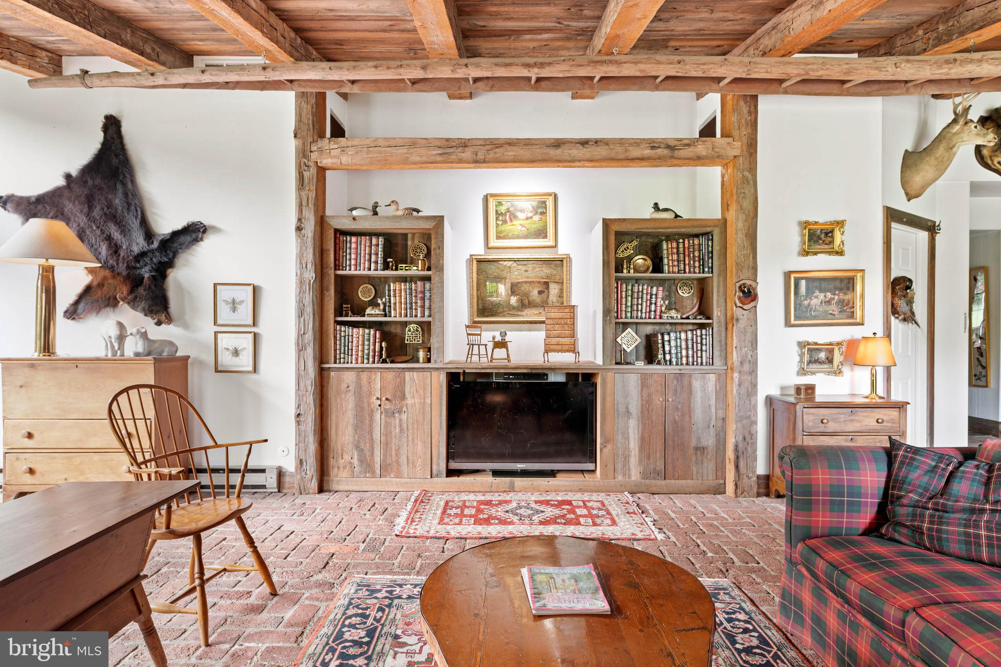 2070 Huntingdon Road Huntingdon Valley, PA 19006 - Photo 41 of 76 a living room with furniture and a fireplace