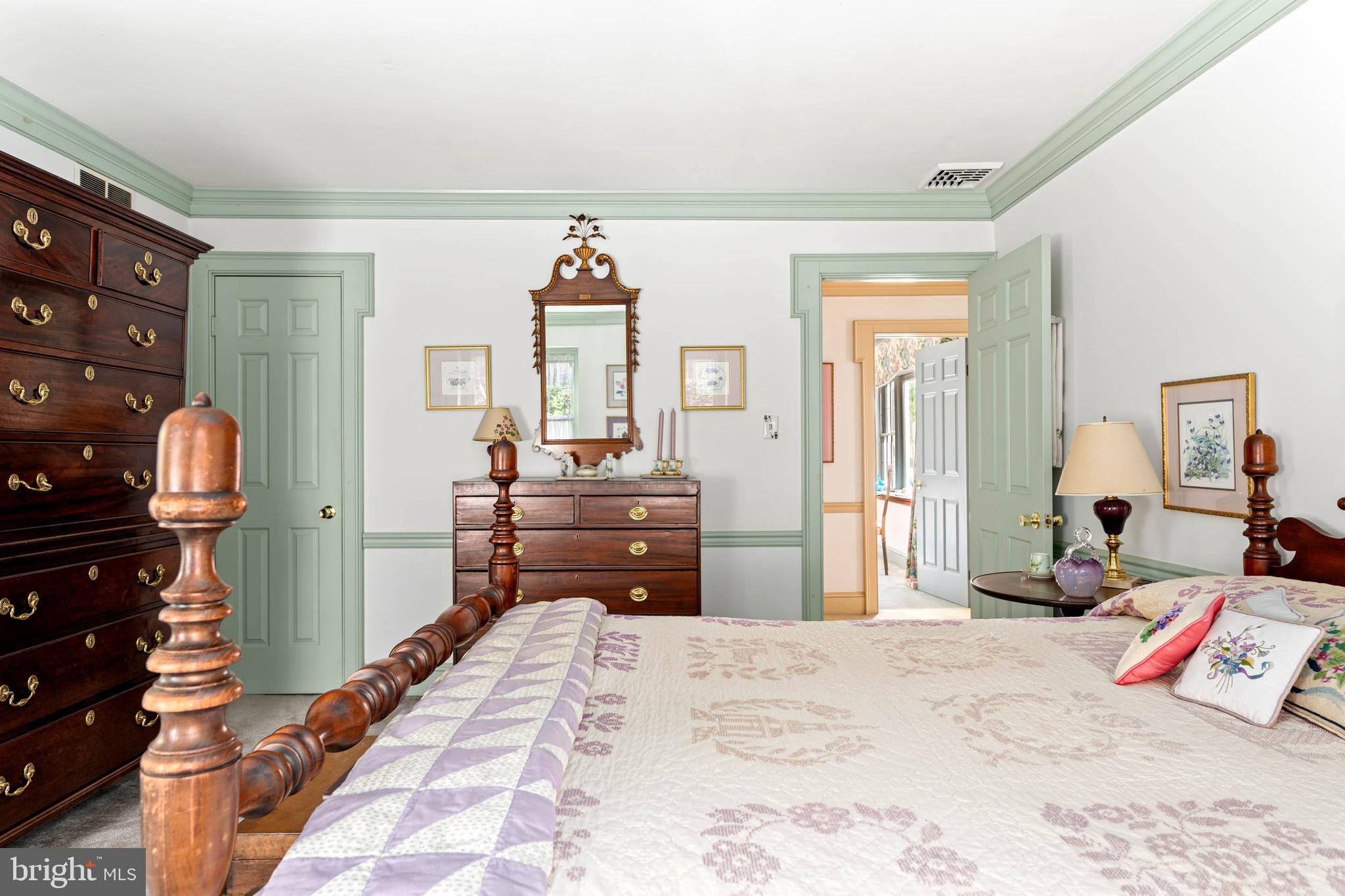 2070 Huntingdon Road Huntingdon Valley, PA 19006 - Photo 48 of 76 a bedroom with a bed and wooden floor