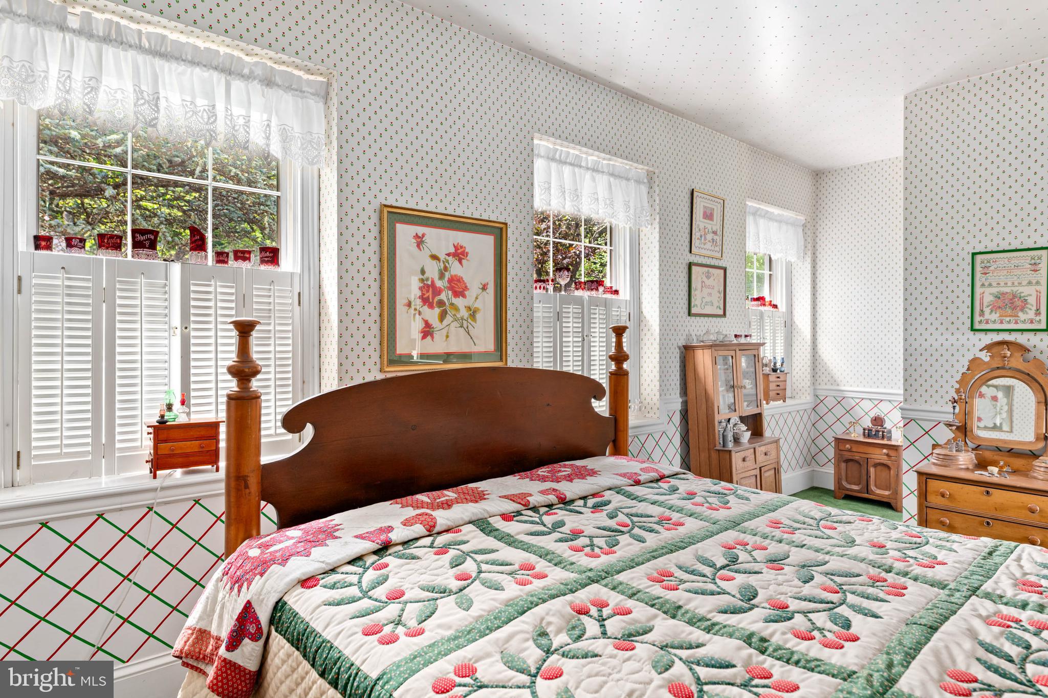 2070 Huntingdon Road Huntingdon Valley, PA 19006 - Photo 58 of 76 a bedroom with a bed a dresser next to a window