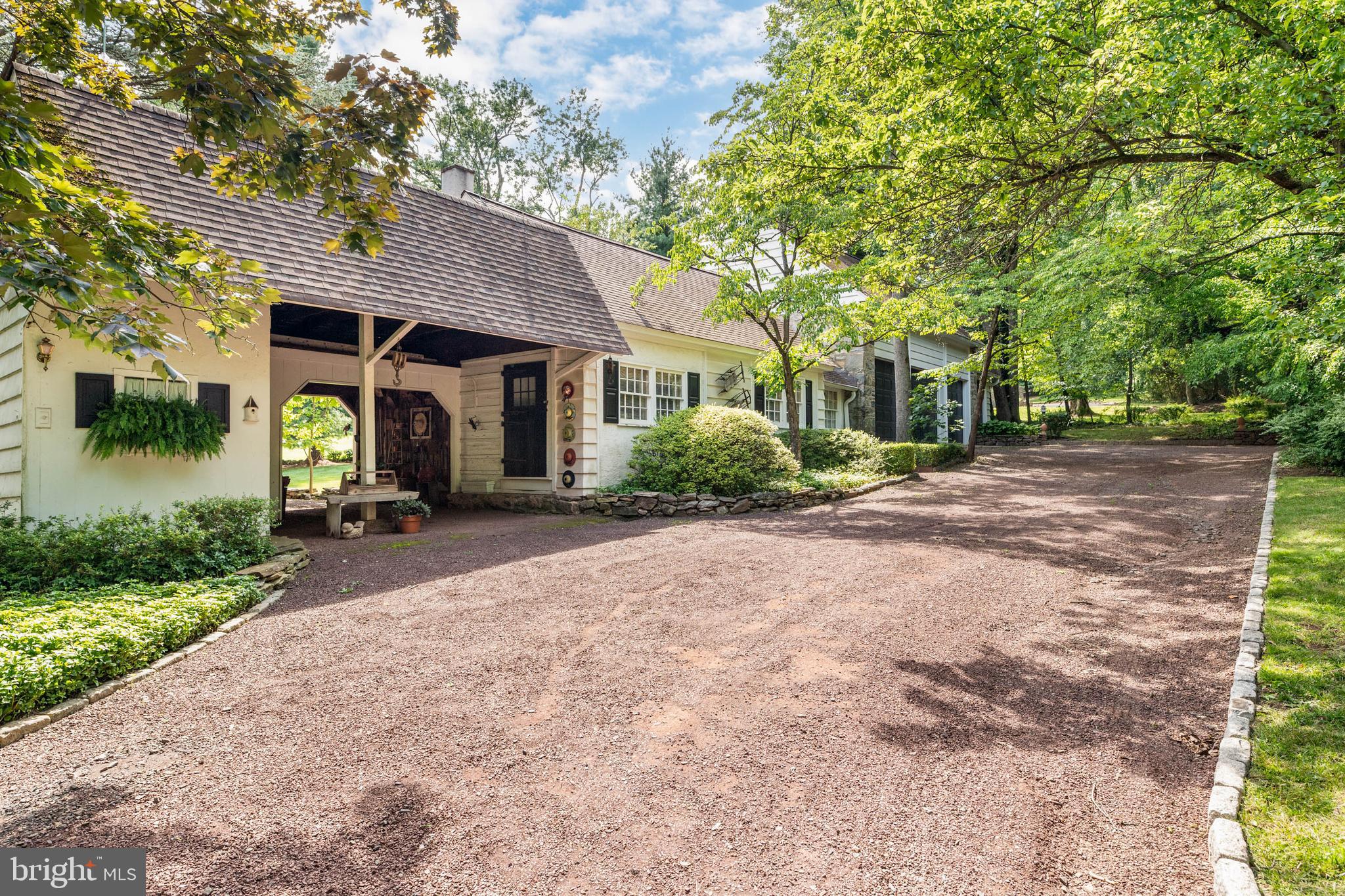 2070 Huntingdon Road Huntingdon Valley, PA 19006 - Photo 62 of 76 a front view of a house with a garden