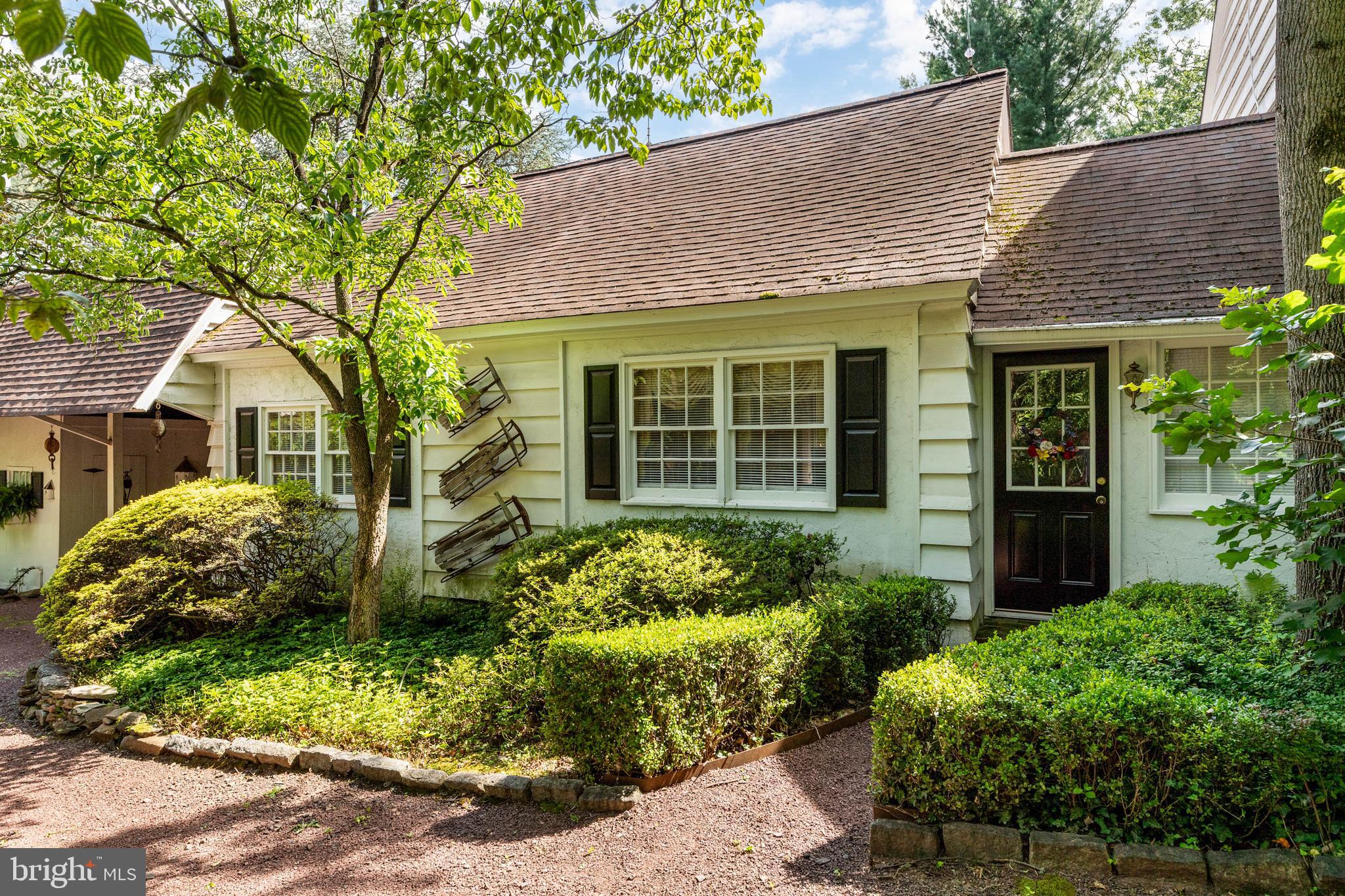 2070 Huntingdon Road Huntingdon Valley, PA 19006 - Photo 67 of 76 a front view of a house with a garden