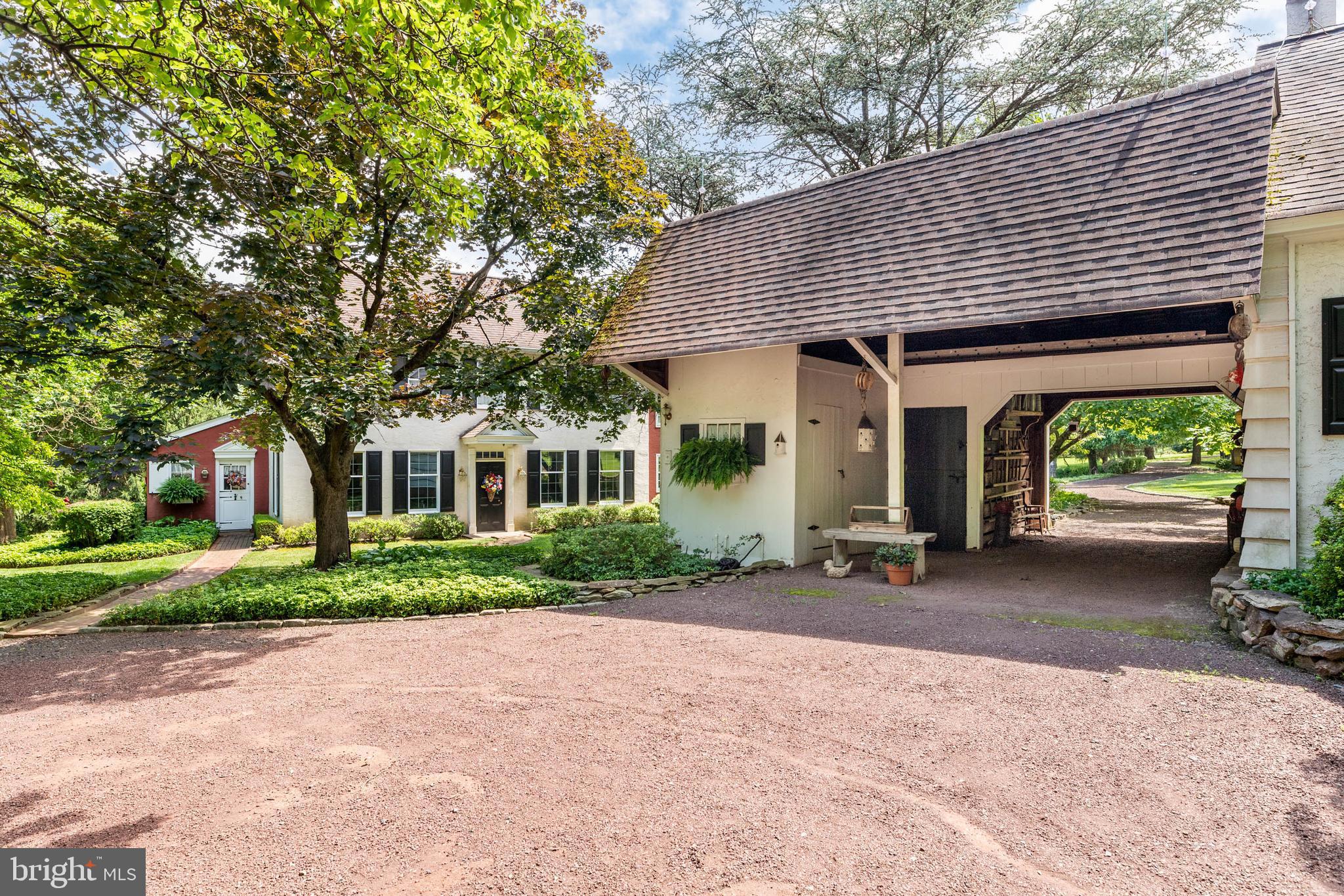 2070 Huntingdon Road Huntingdon Valley, PA 19006 - Photo 7 of 76 a front view of a house with a yard and porch