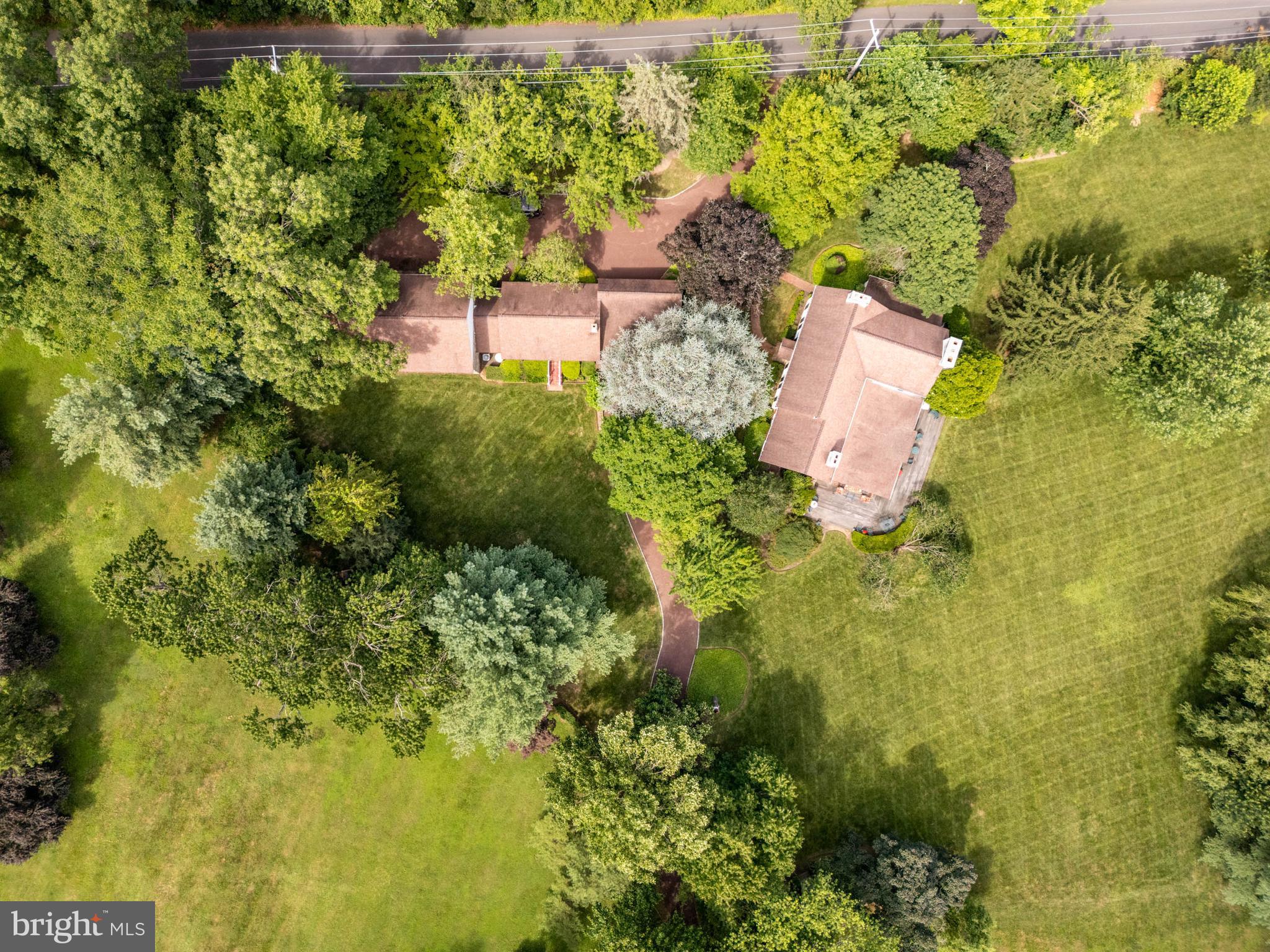 2070 Huntingdon Road Huntingdon Valley, PA 19006 - Photo 75 of 76 an aerial view of residential house with swimming pool and large trees