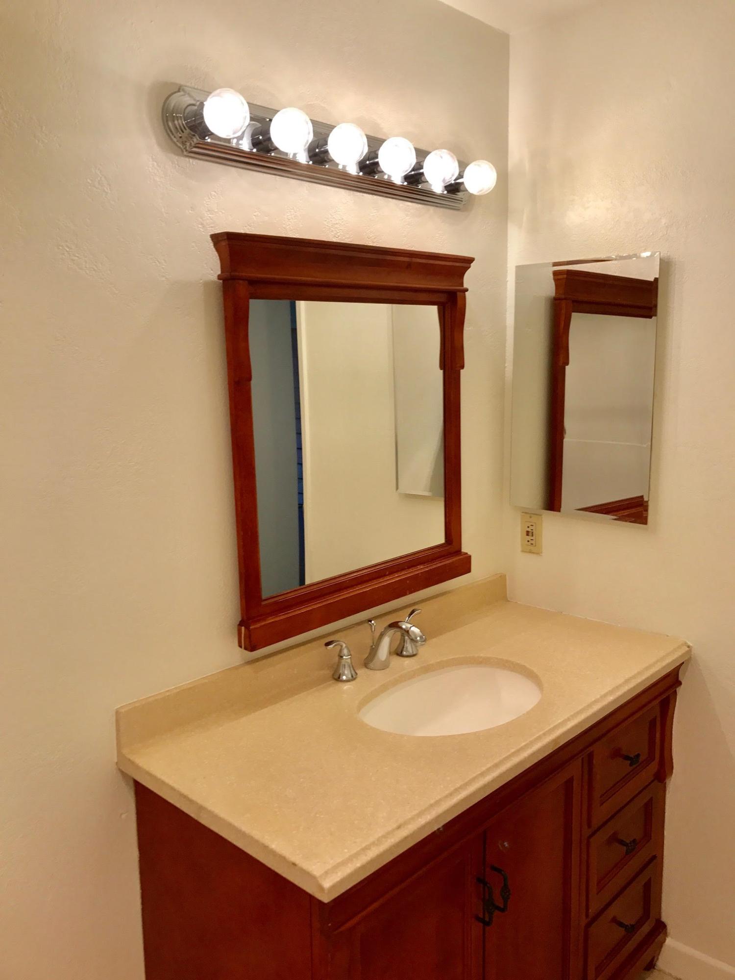1815 Bath Street, Unit 1 Santa Barbara, CA 93101 - Photo 12 of 19 a bathroom with a sink vanity and a mirror