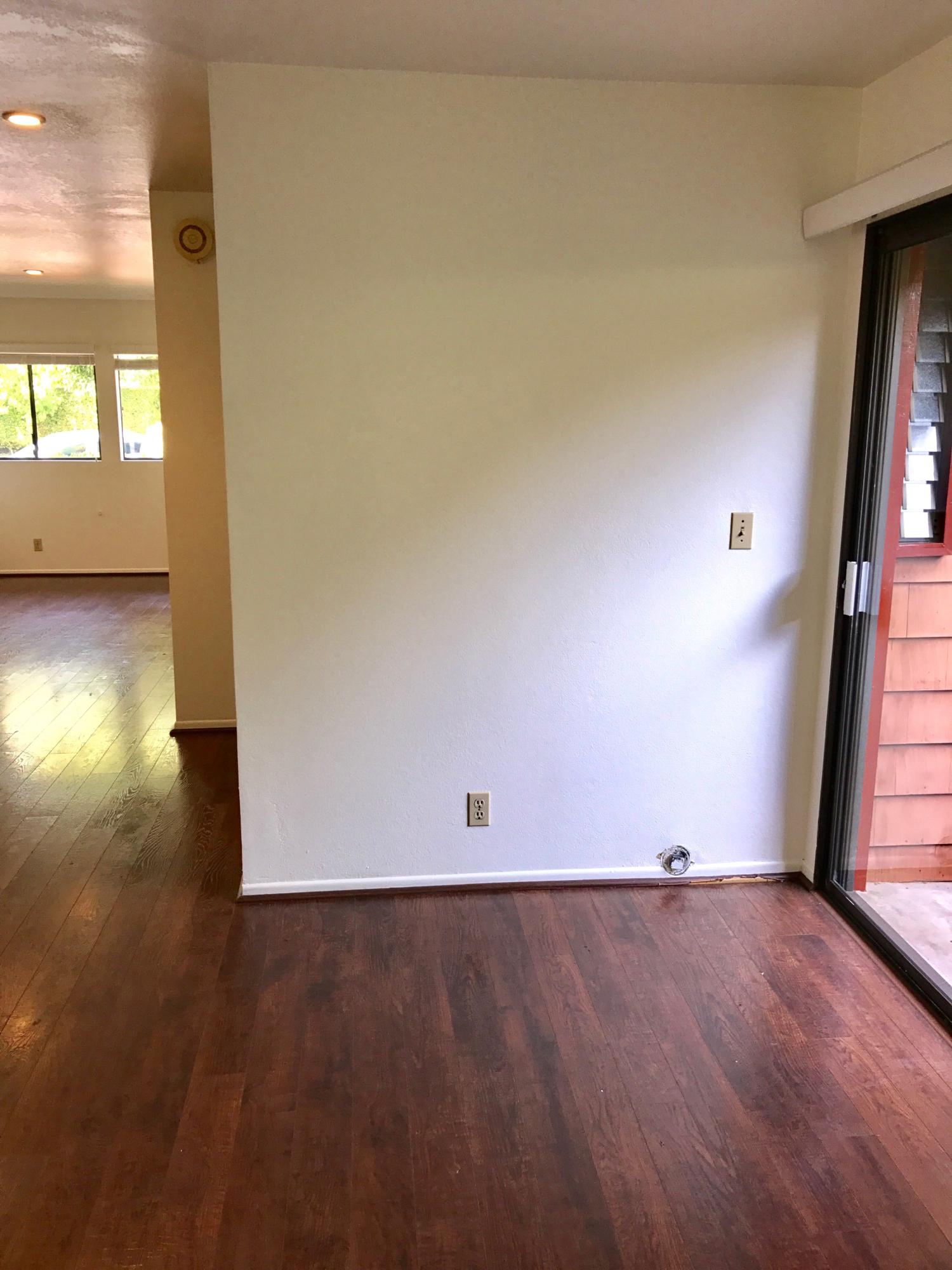1815 Bath Street, Unit 1 Santa Barbara, CA 93101 - Photo 13 of 19 an empty room with wooden floor and windows