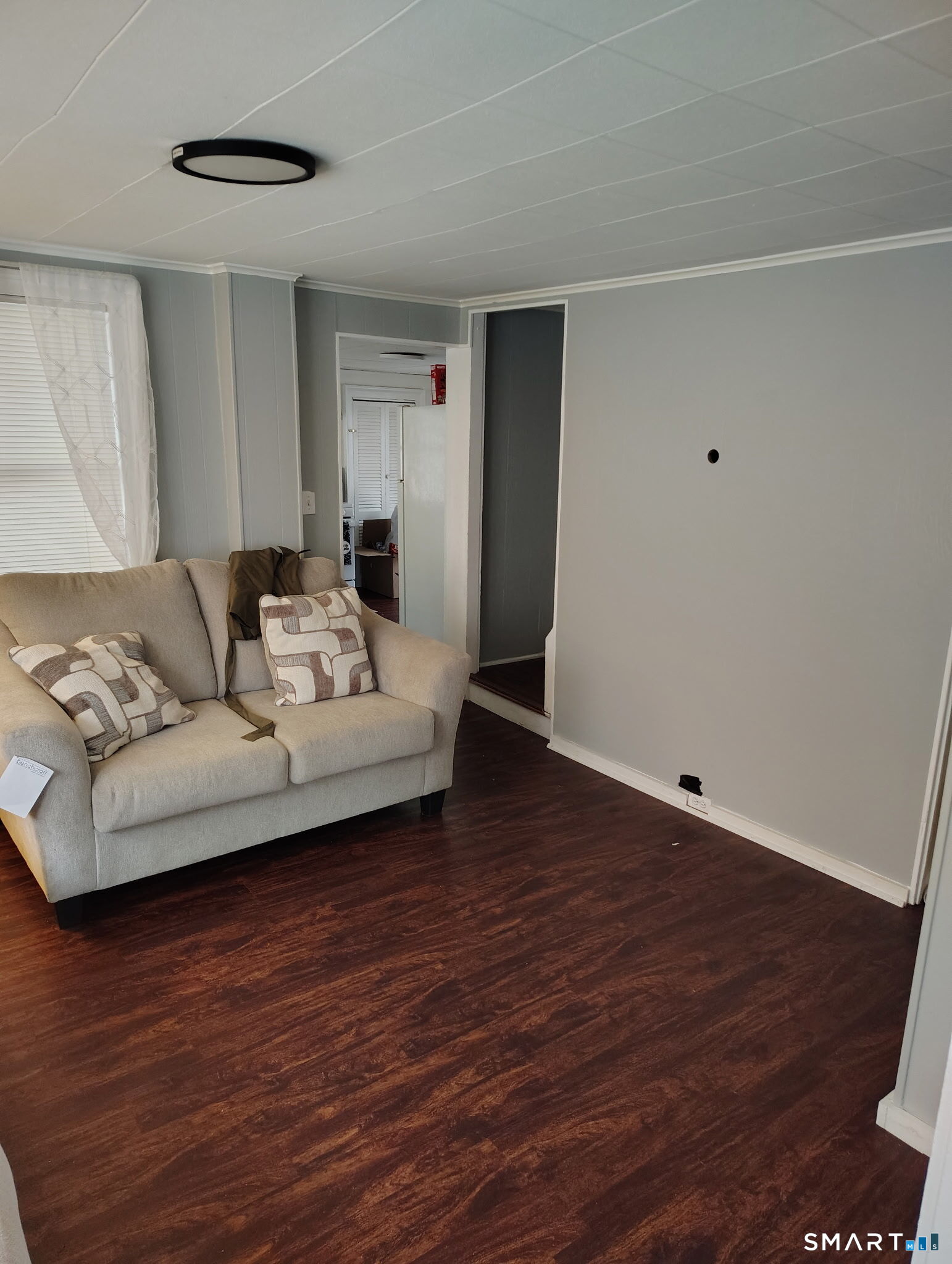 25 George Street Torrington, CT 06790 - Photo 14 of 34 a living room with furniture and a wooden floor