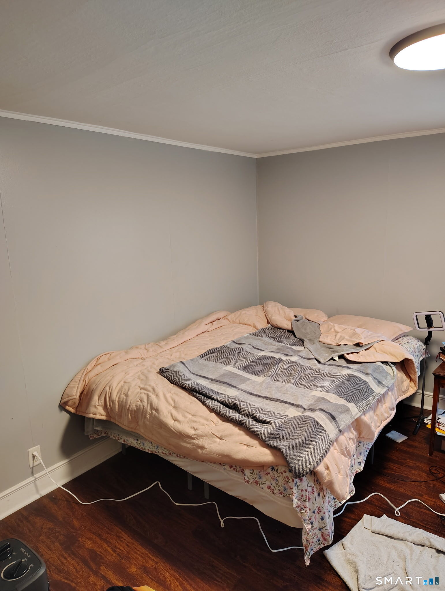 25 George Street Torrington, CT 06790 - Photo 16 of 34 a bedroom with a bed and wooden floor