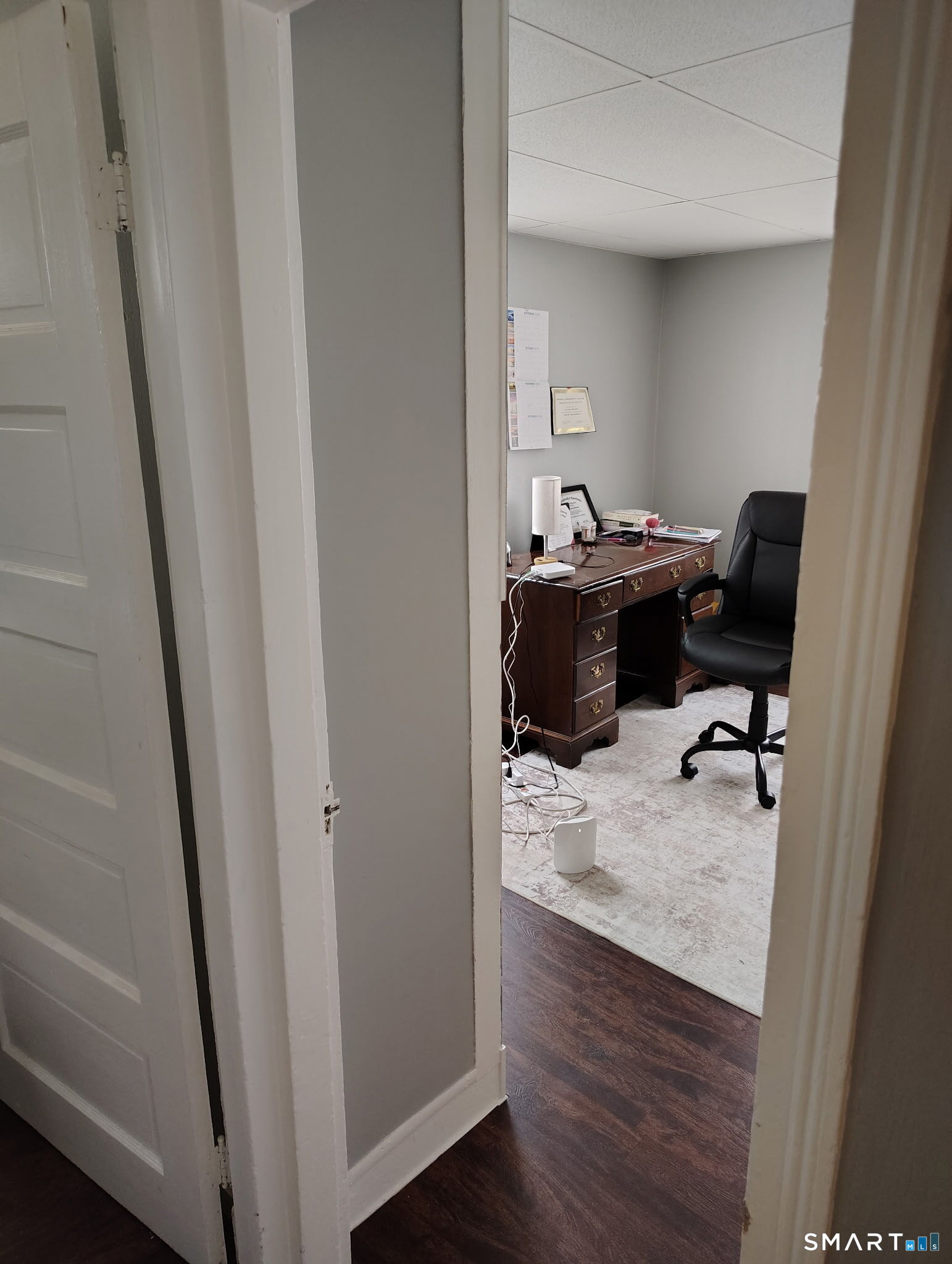 25 George Street Torrington, CT 06790 - Photo 5 of 34 a view of a workspace with furniture and a gate