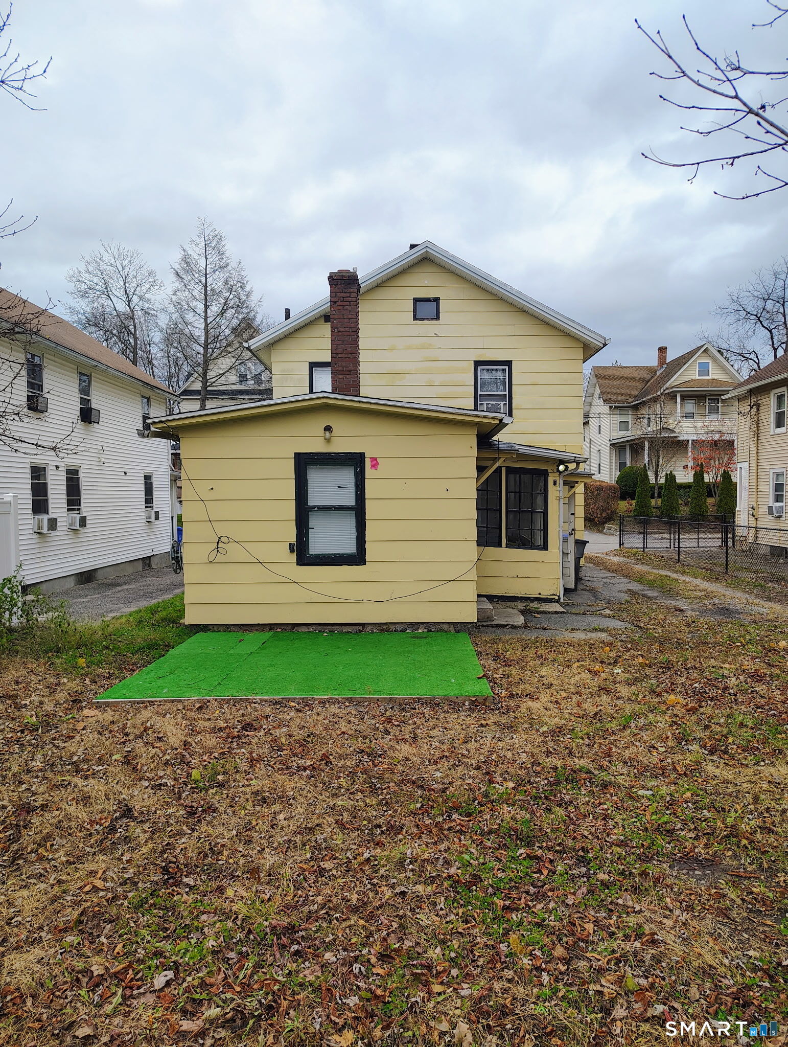 25 George Street Torrington, CT 06790 - Photo 9 of 34 a front view of a house with a yard