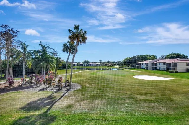 a view of a lake with a yard
