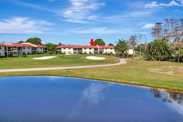 a view of a swimming pool with an outdoor seating