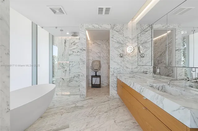 a living room with furniture and a lamp