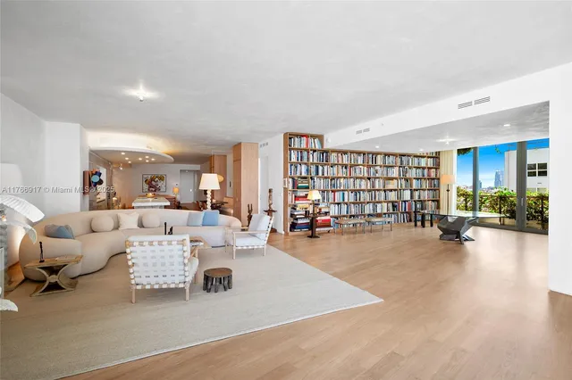 a living room with a table and chairs