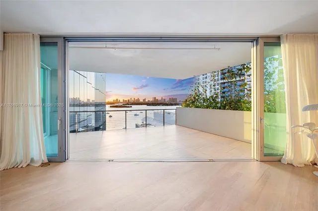 a living room with furniture and painting on the wall