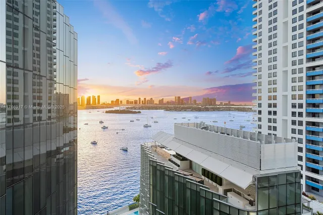 a bedroom with a bed and a view of balcony