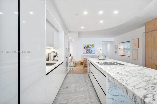 a living room with furniture a table and a large window