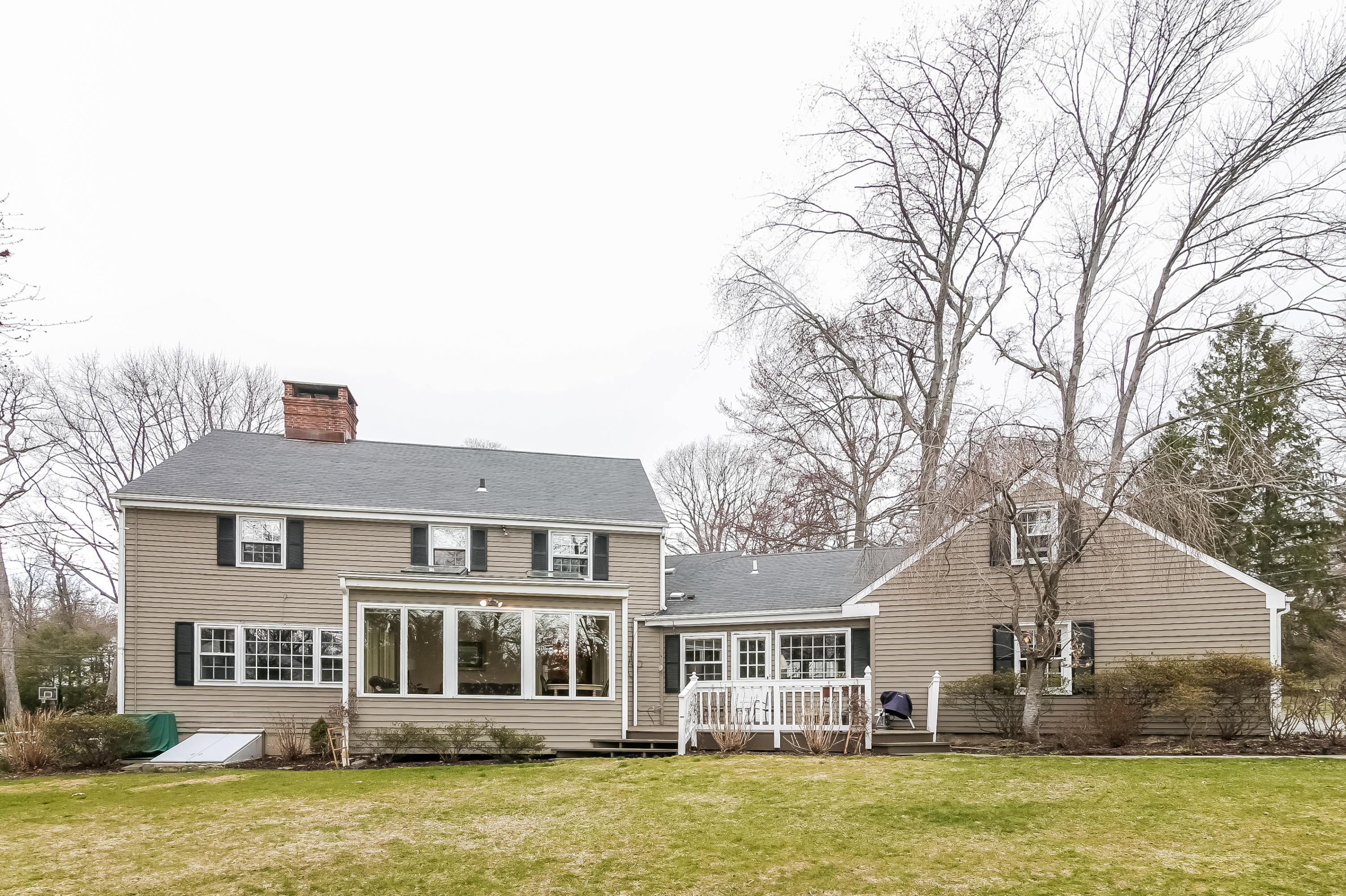 101 Colony Road Darien, CT 06820 - Photo 24 of 31 a front view of a house with a garden