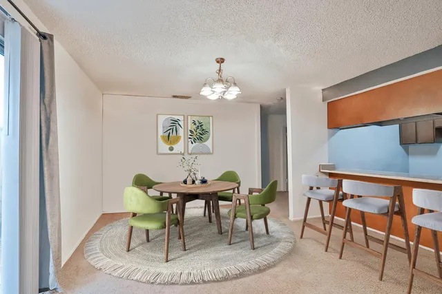 a dining room with furniture and window